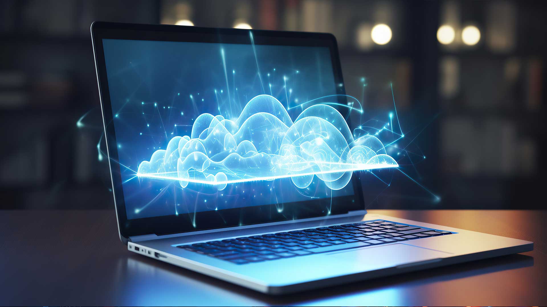 a laptop with a glowing cloud on the screen